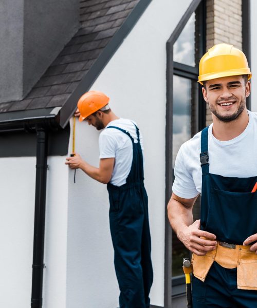 selective-focus-of-happy-handyman-in-uniform-near-service.jpg selective-focus-of-happy-handyman-in-uniform-near-service.jpg